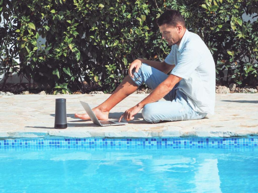 young-man-wearing-jeans-shirt-is-working-with-laptop-near-swimming-pool_0x800 young-man-wearing-jeans-shirt-is-working-with-laptop-near-swimming-pool_0x800